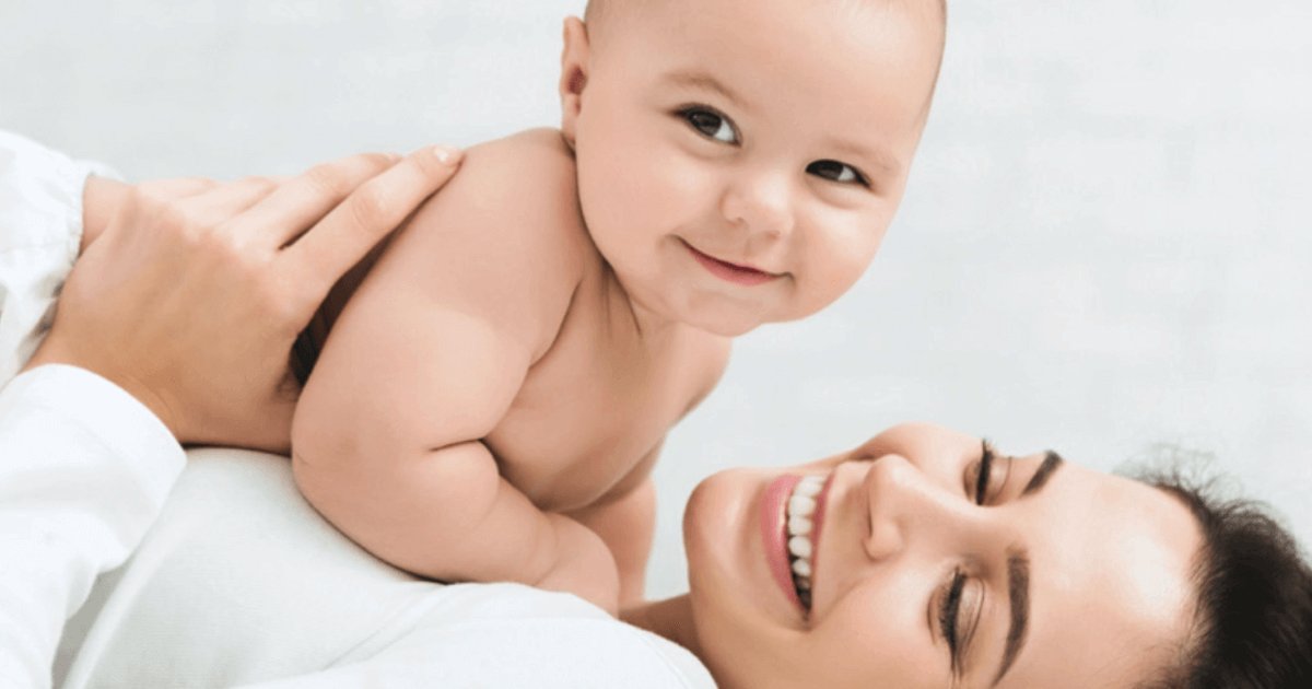 A smiling mum with her baby, for Luxe ToneUP body toning at BMB