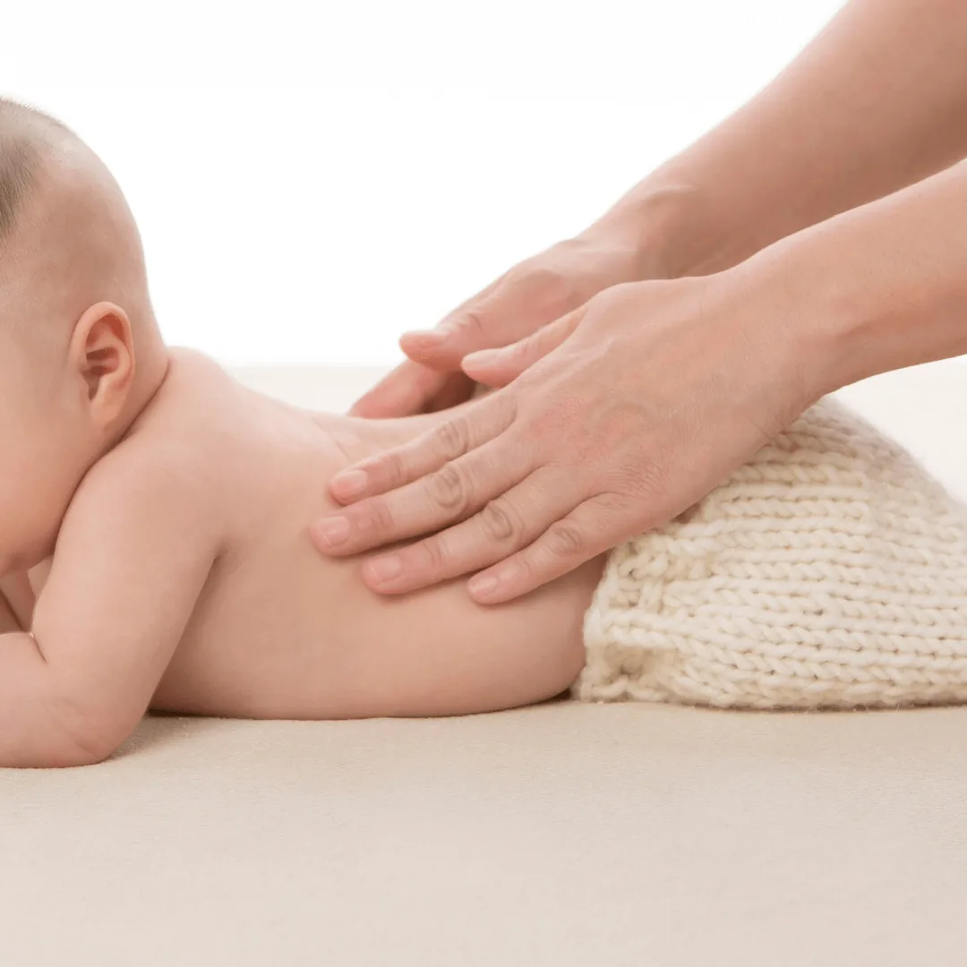 Therapist gently massaging a baby at BMB