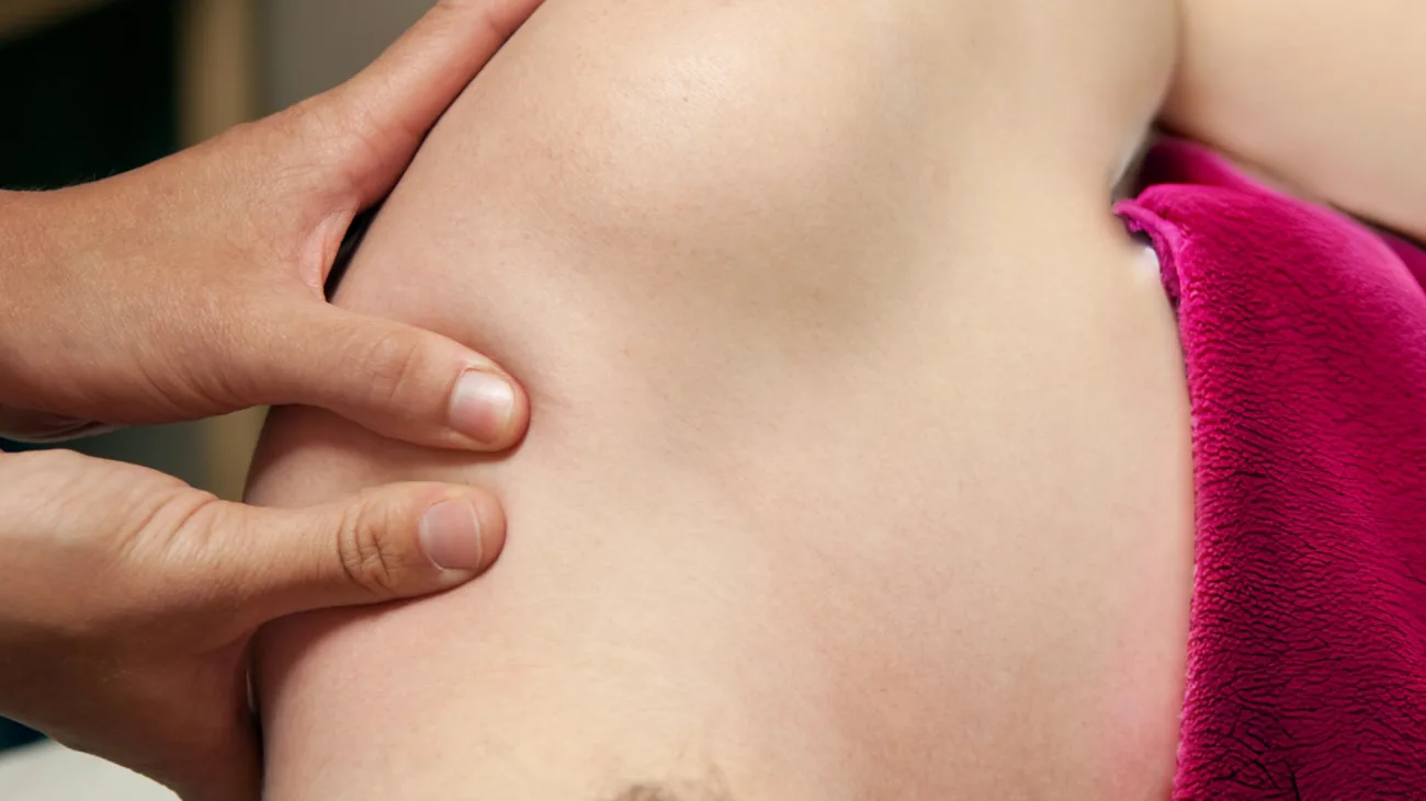 Therapist working through prenatal massage strokes at BMB Orchard
